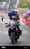 bbc-sport-tv-camera-bike-filming-the-runners-near-tower-bridge-during-J2JM8B.jpg